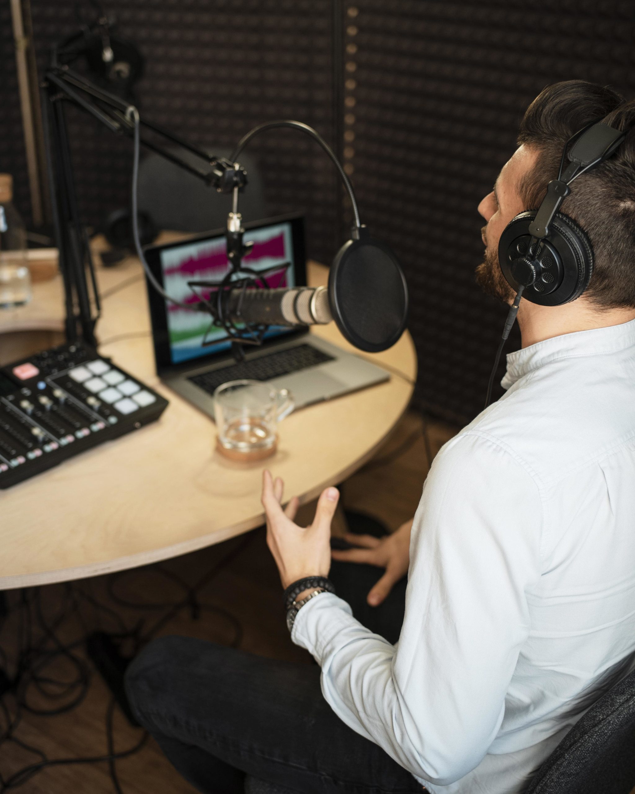 man-working-radio-station-high-angle-min